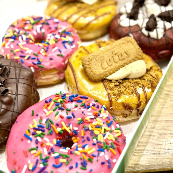 A batch of doughnuts in a box